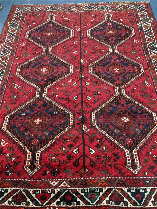 A Belouch red ground carpet 244 x 180cm